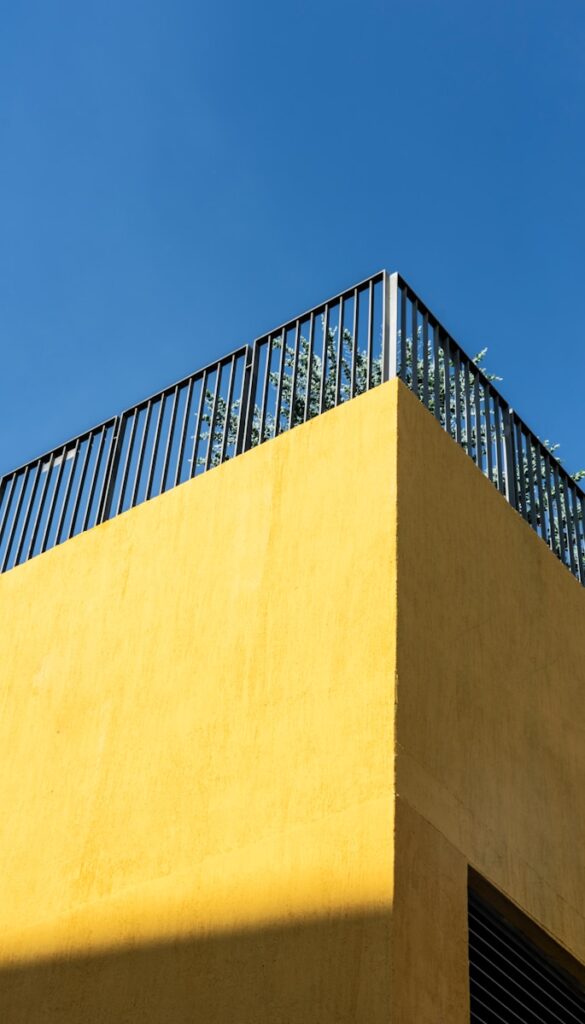 brown concrete wall under blue sky during daytime