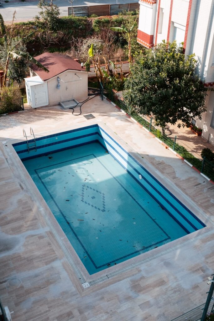 an empty swimming pool in a residential area